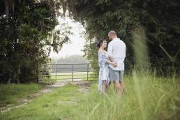 engaged couple in grass at state park